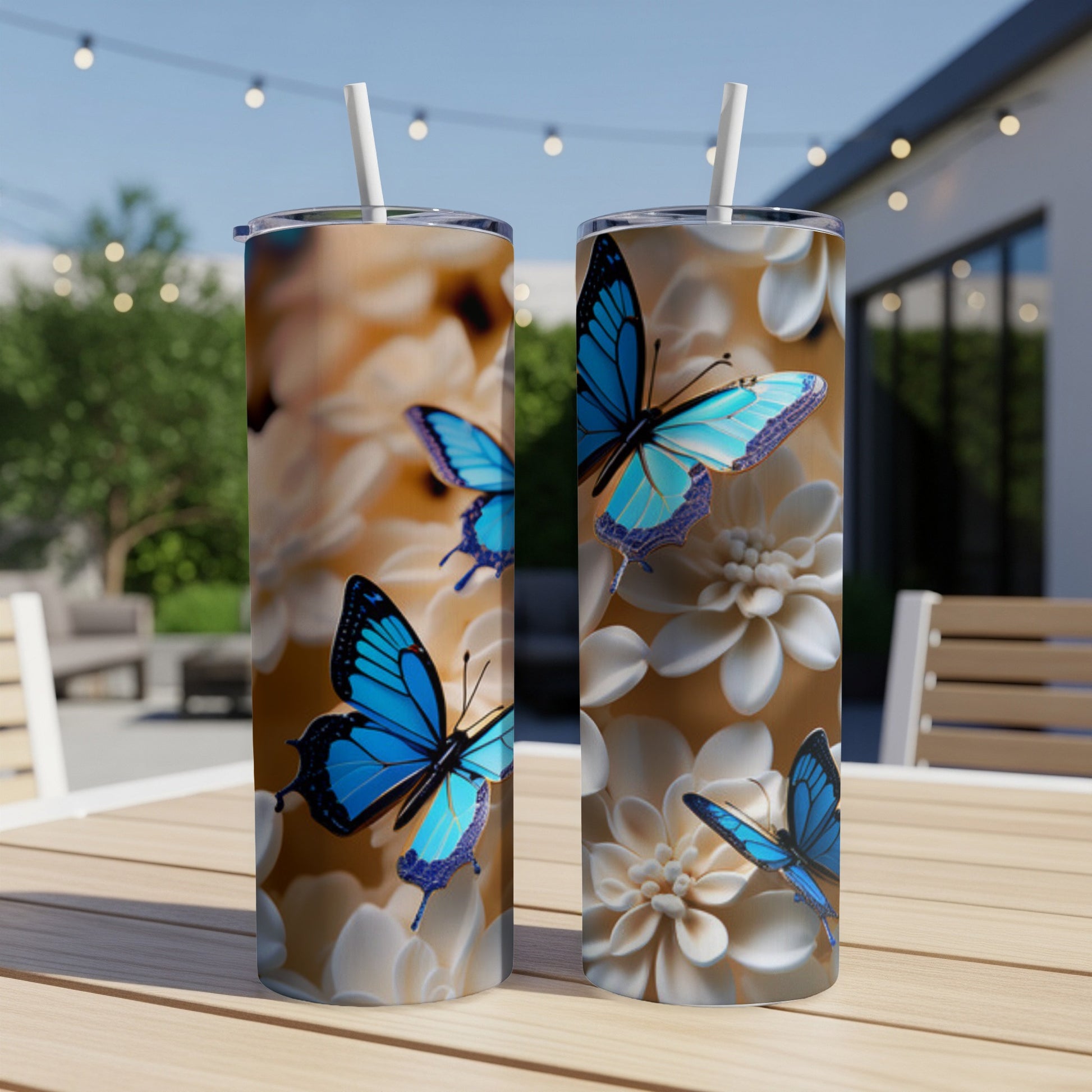 Two tall tumblers with blue butterflies and white floral pattern.