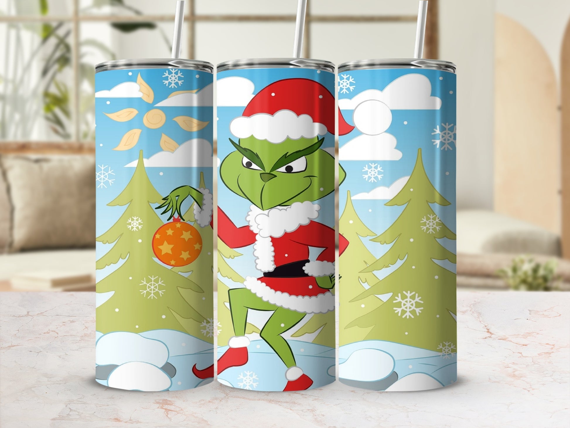 The Grinch in a Santa hat holding a Christmas ornament with snow and trees.
