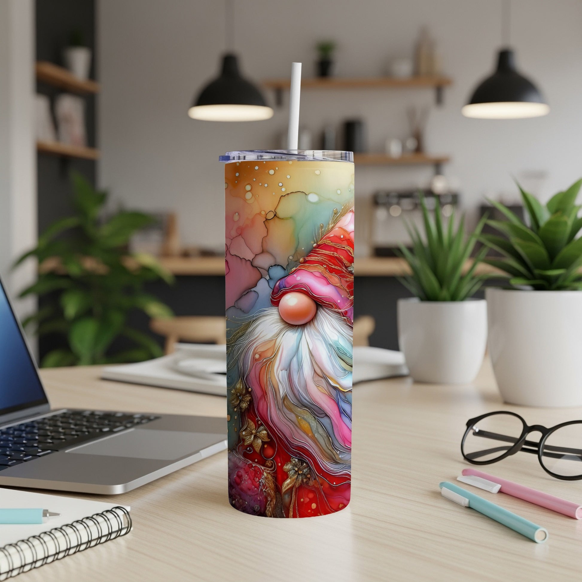 Colorful gnome tumbler with festive holiday accents, on a desk.