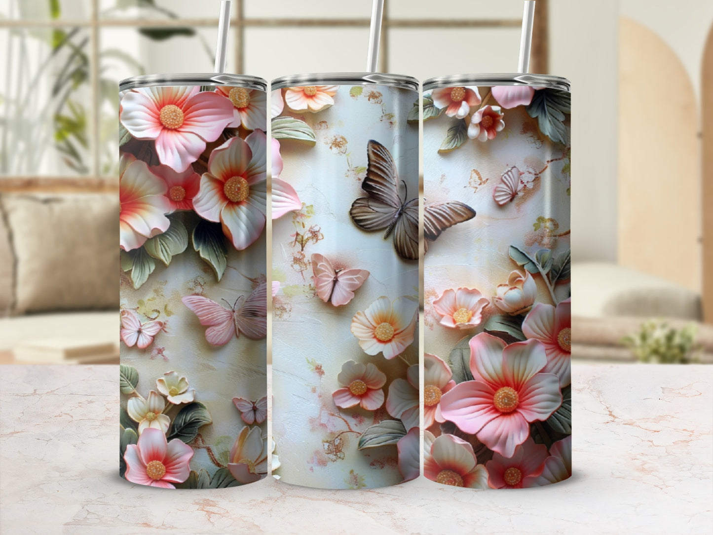 Three tumblers with a floral and butterfly embossed design.