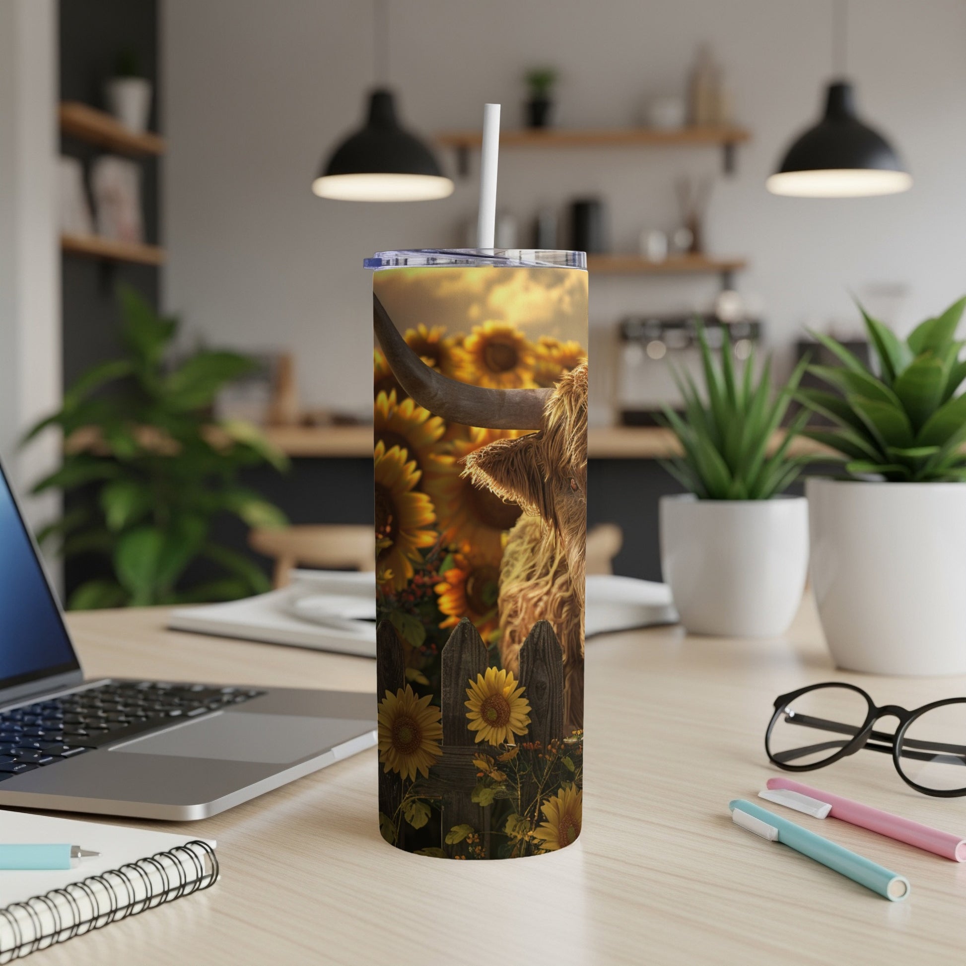 Highland cow and sunflowers on a tall, insulated tumbler.
