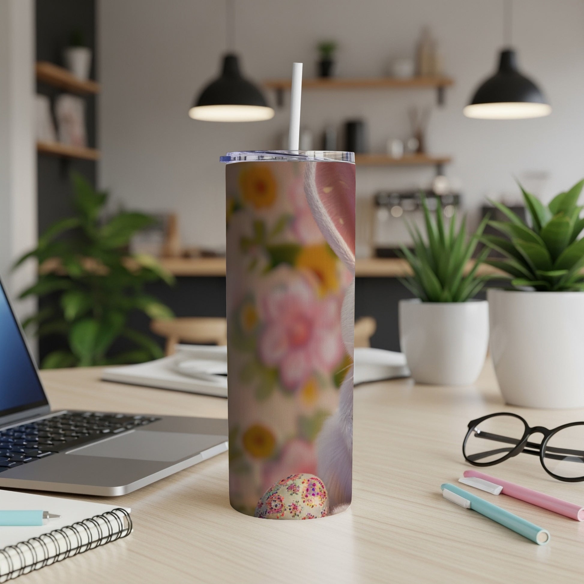 Easter bunny and egg pattern on a white tumbler with a straw.