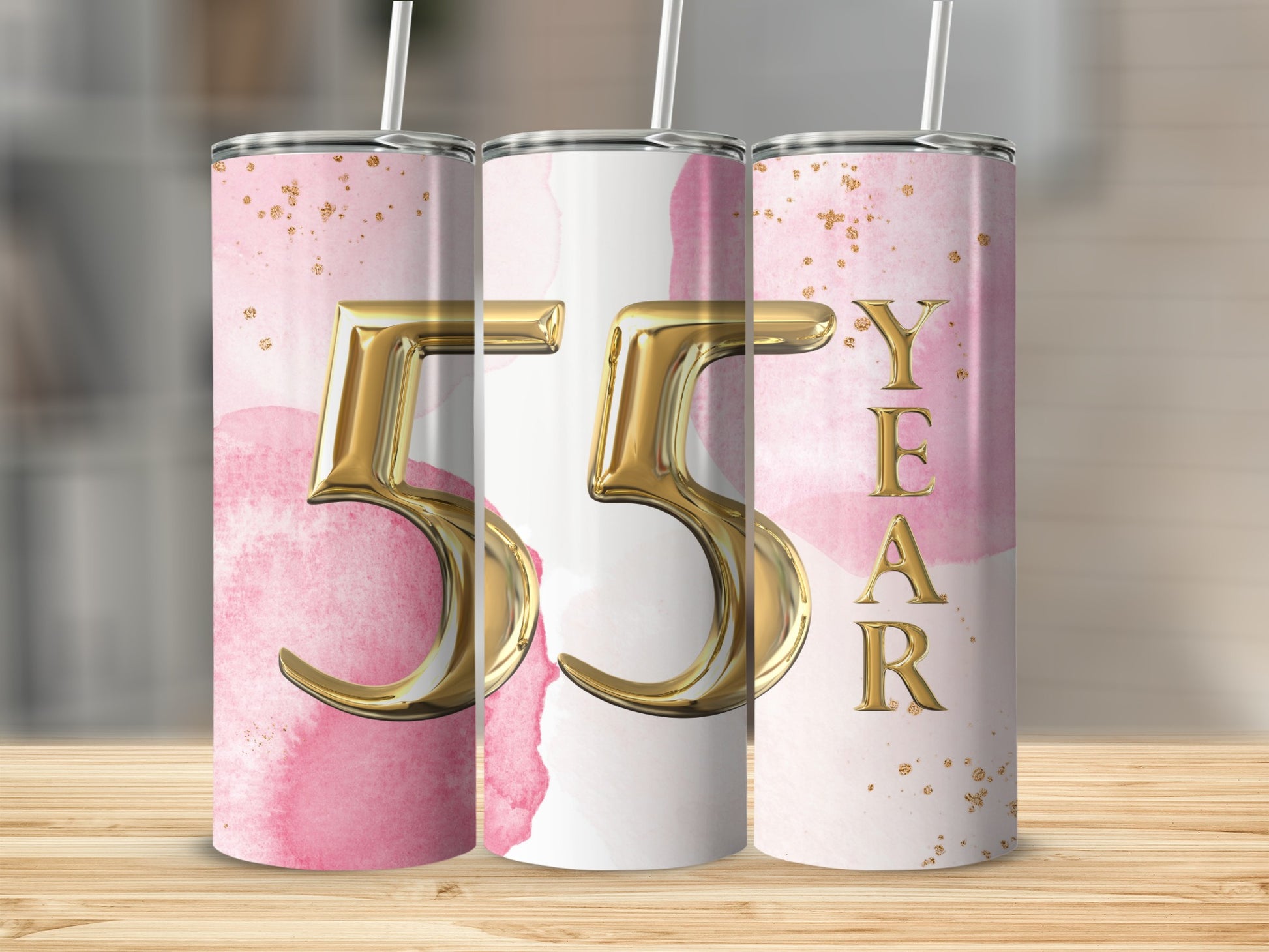 Tumbler with "55 YEAR" in gold lettering on a pink watercolor background.