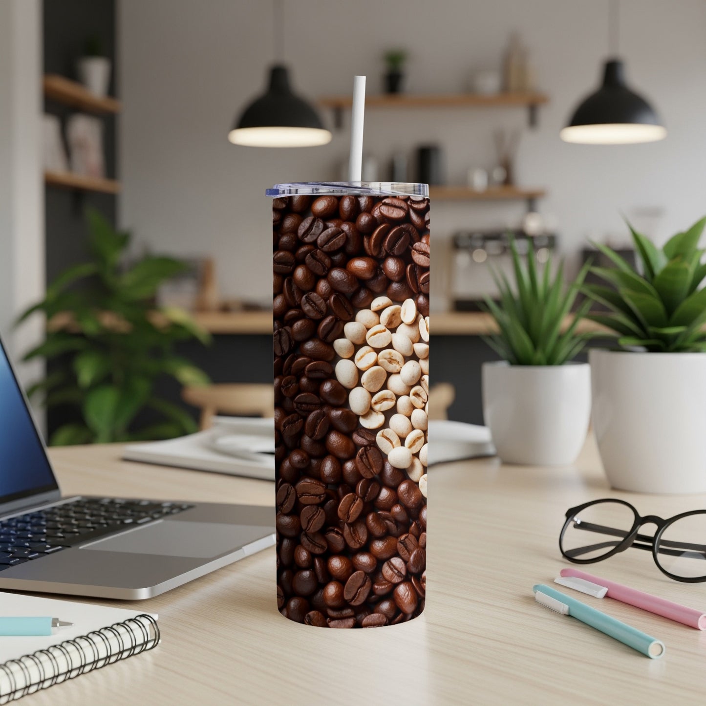 Coffee beans art on a white tumbler with a straw.