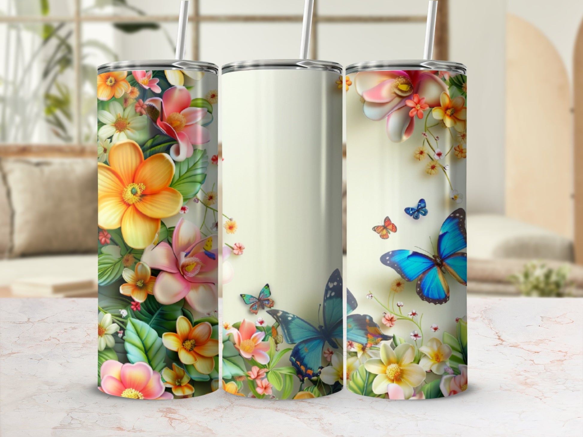 Three tumblers featuring vibrant floral and butterfly designs.