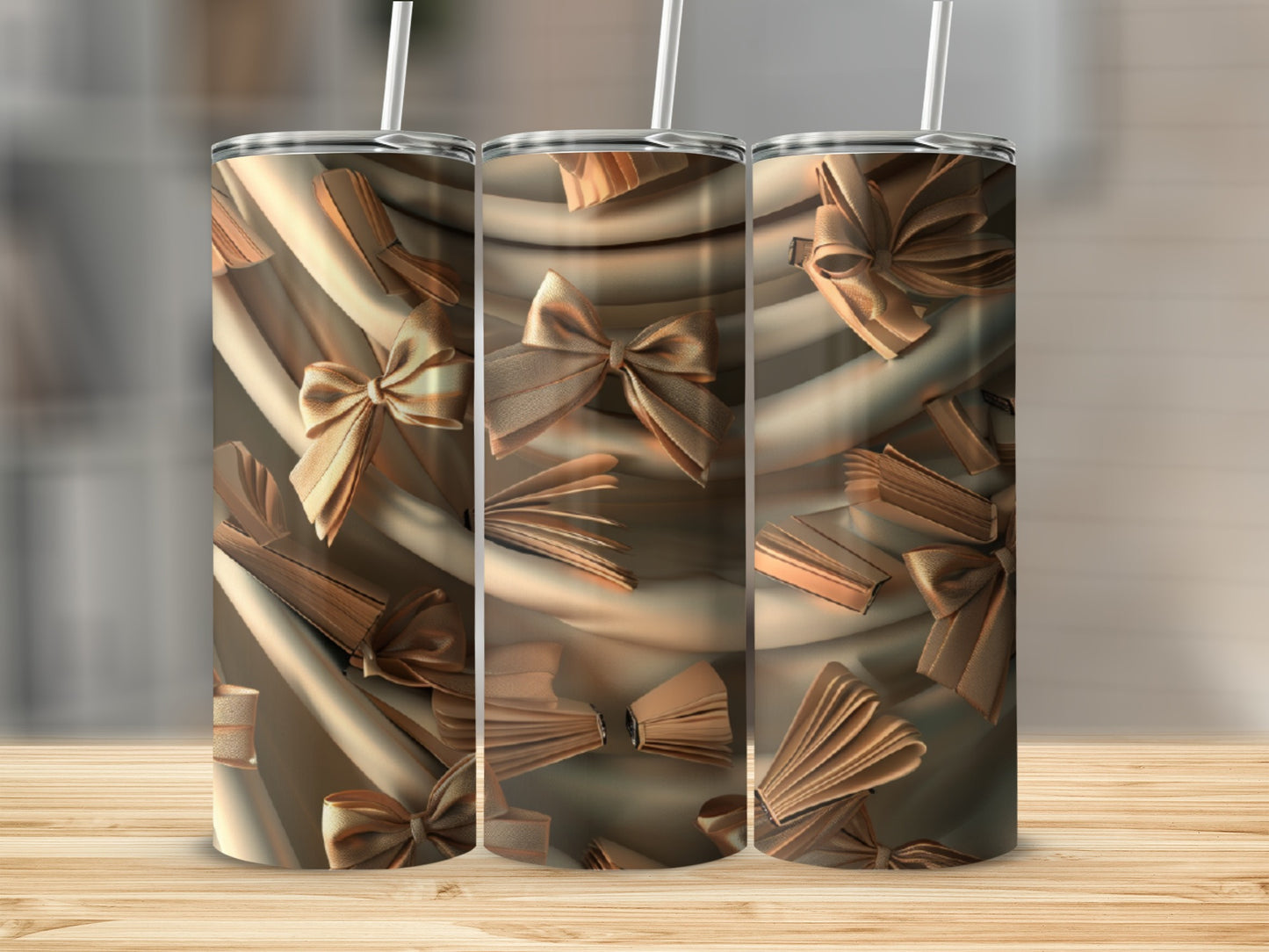 Three tumblers with a gold ribbon and open book pattern.