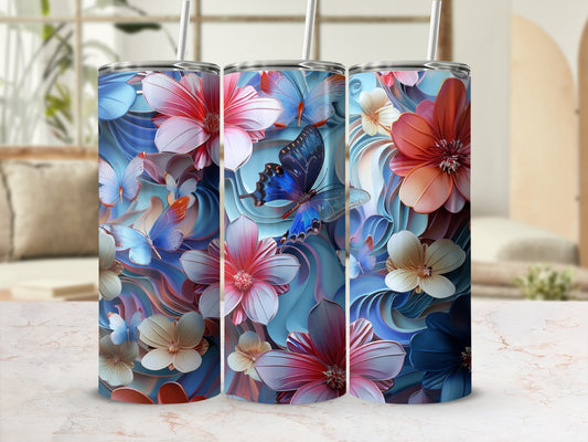 Three tumblers with floral and butterfly designs on a marbled surface.