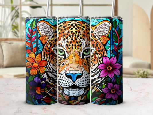 Leopard face stained glass design on three tumblers with straws.