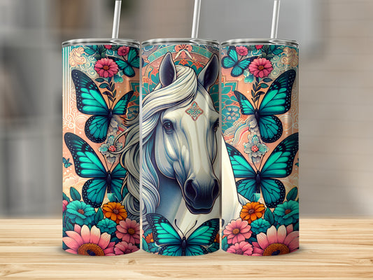 White horse with colorful butterflies and floral designs on a tumbler.