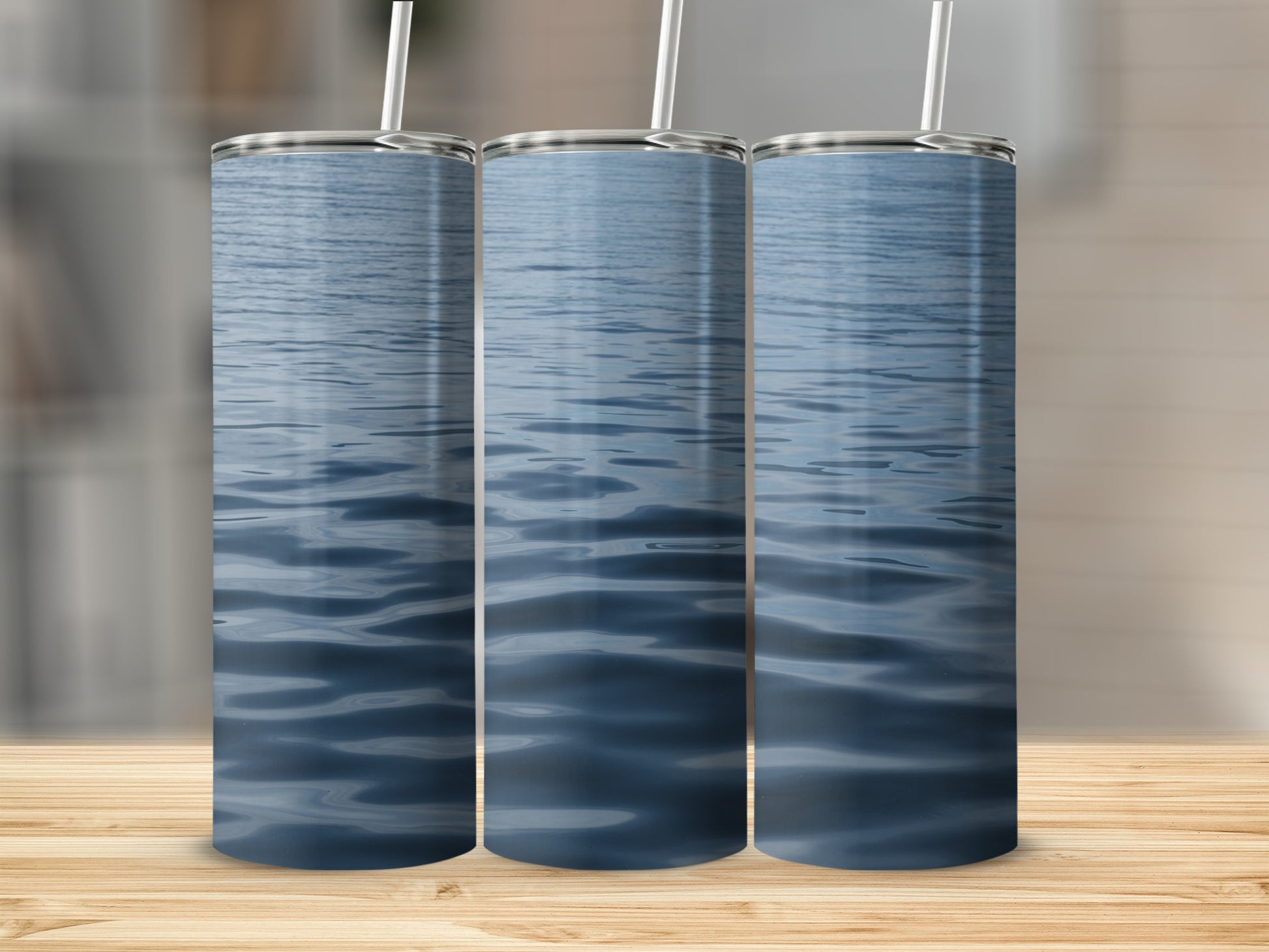 Three tumblers with a rippling blue water design.
