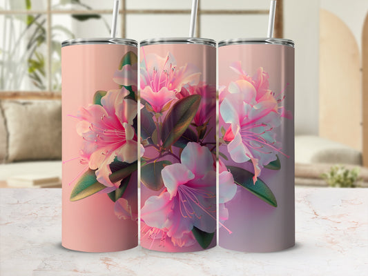 Three pink floral tumblers with straws on a marble surface.