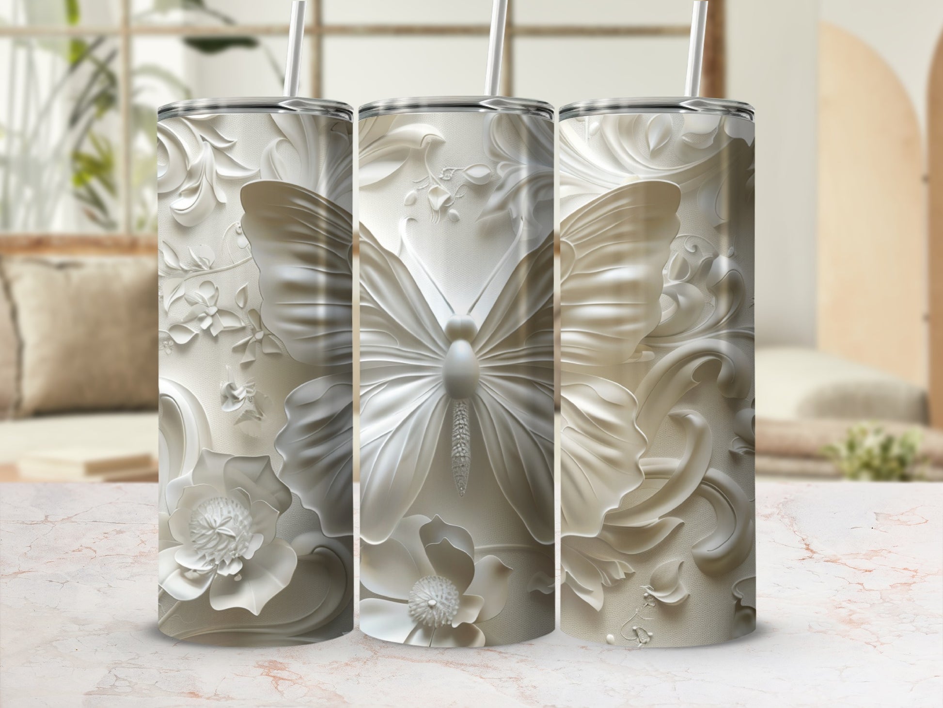 Three white textured tumblers with butterfly and floral embossed designs.
