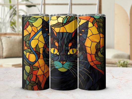 Black cat with yellow eyes on stained glass patterned tumbler.