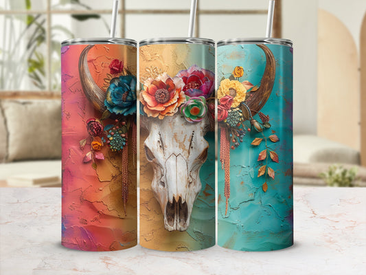 Three tumblers with a floral skull design and colorful, textured backgrounds.