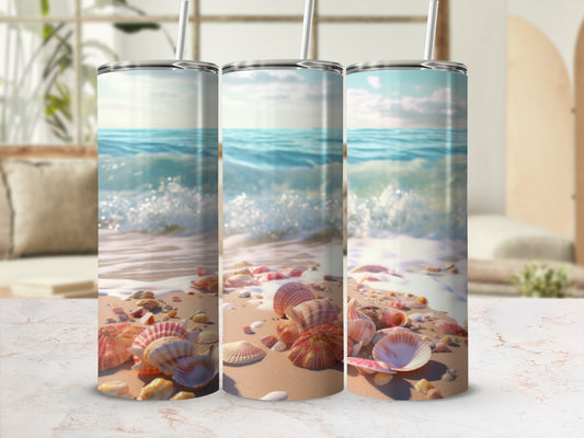Three tumblers with a seashell and beach scene design.