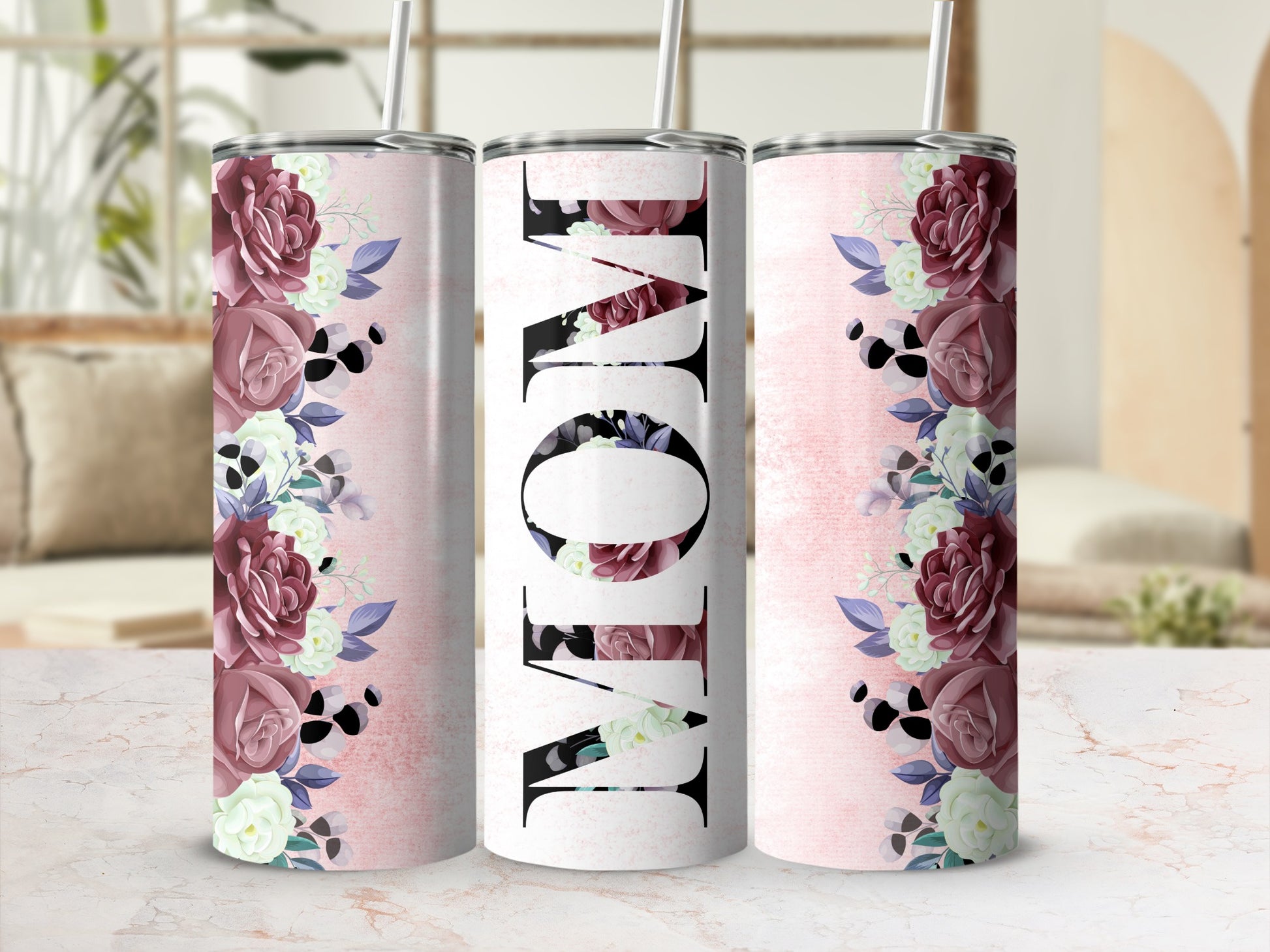 "Mom" text on tumbler with floral design and pink distressed background.