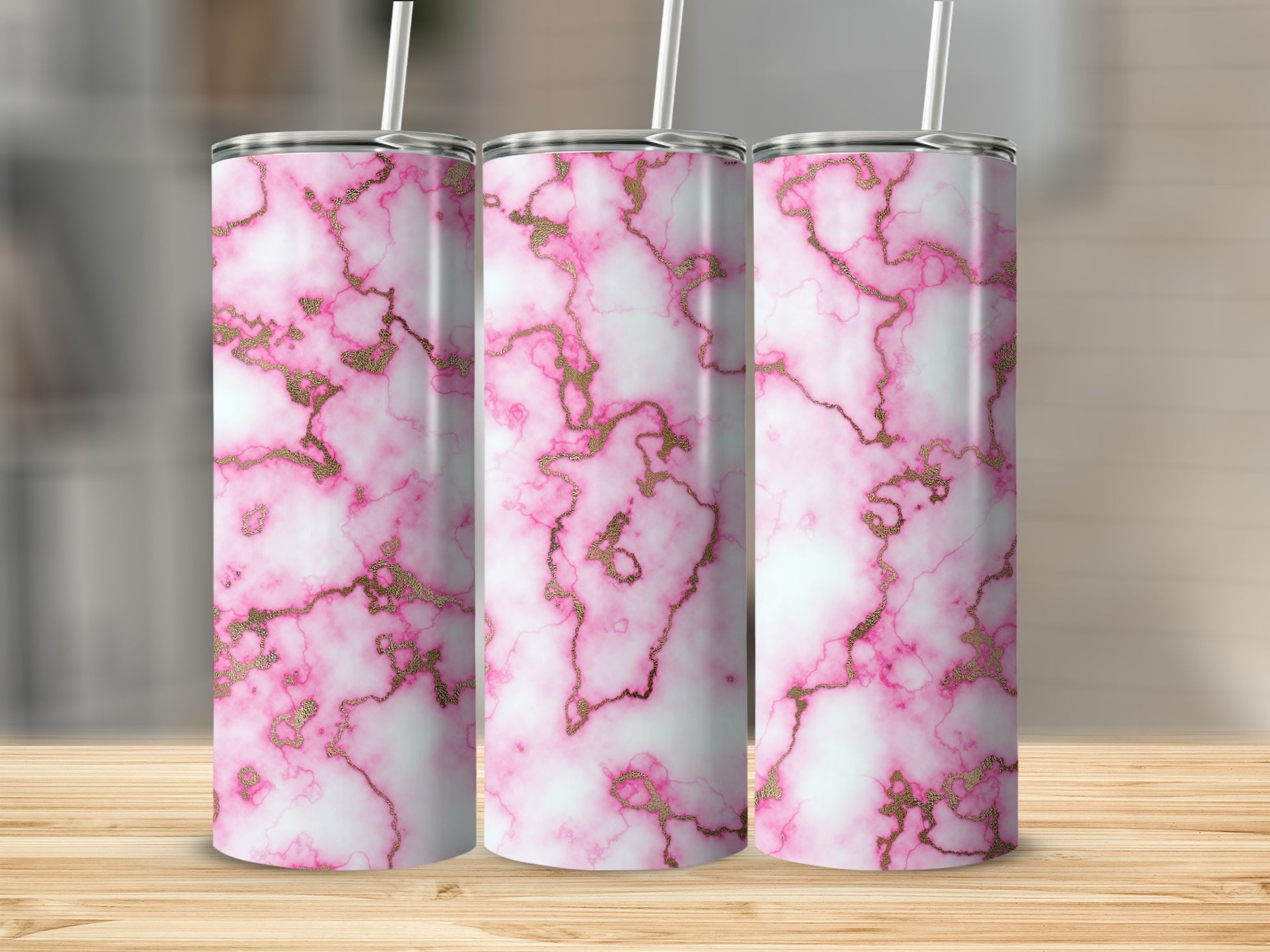 Three tumblers with pink and white marble pattern and gold accents.