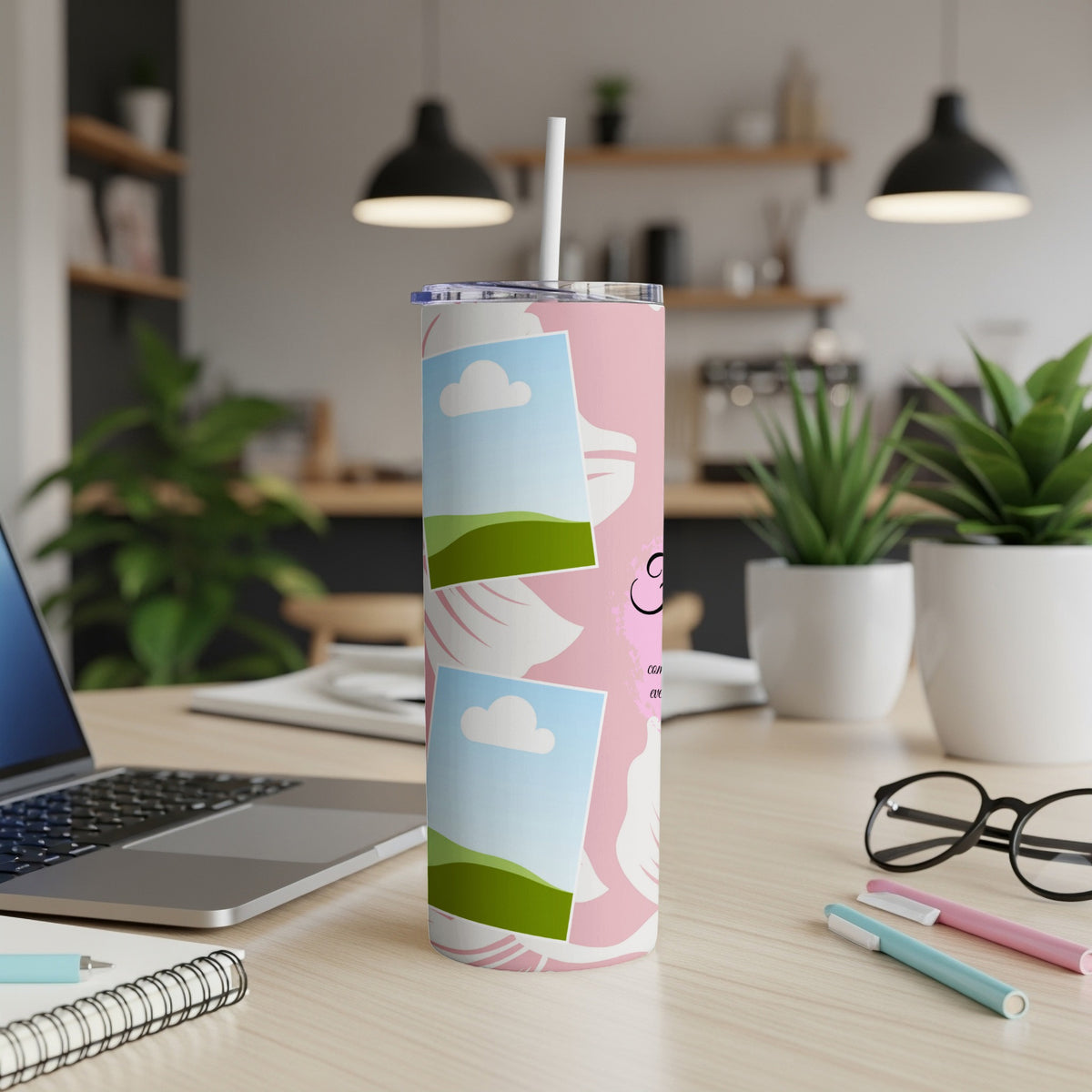 Pink tumbler with white floral design and two photo frames, straw included.