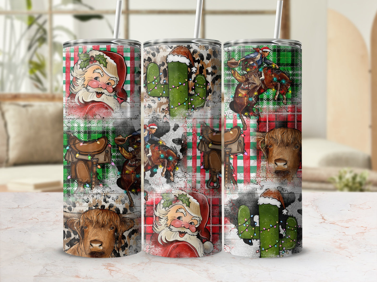 Three tumblers with festive Christmas designs featuring Santa, cacti, and cows.