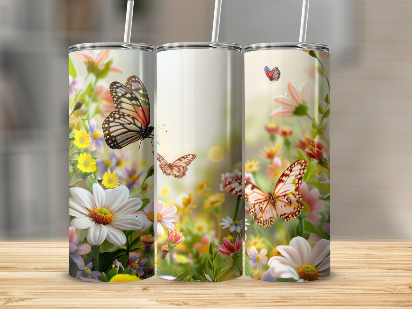 Three tumblers with butterflies and flowers.