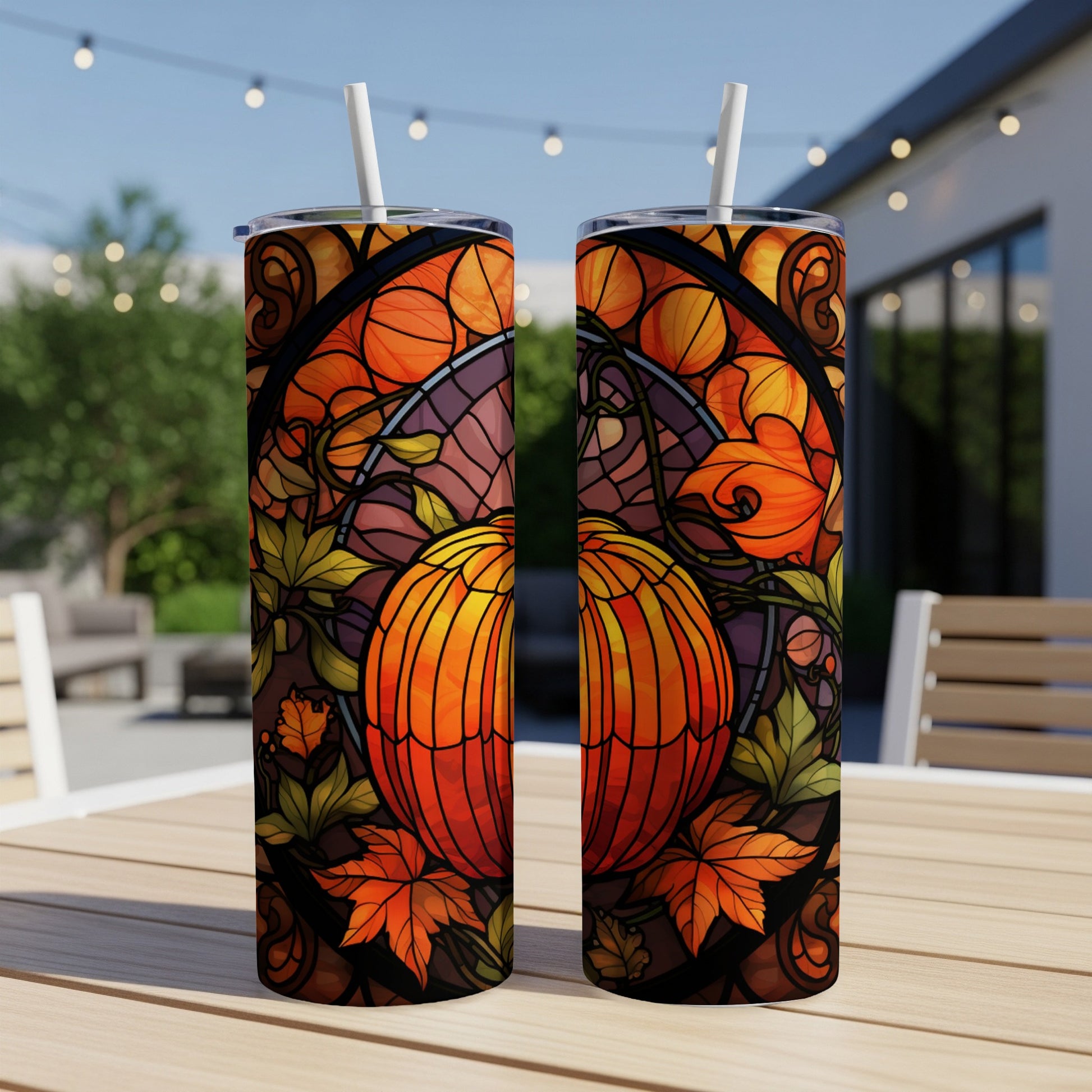 Two tumblers featuring stained glass pumpkin and fall leaves design.