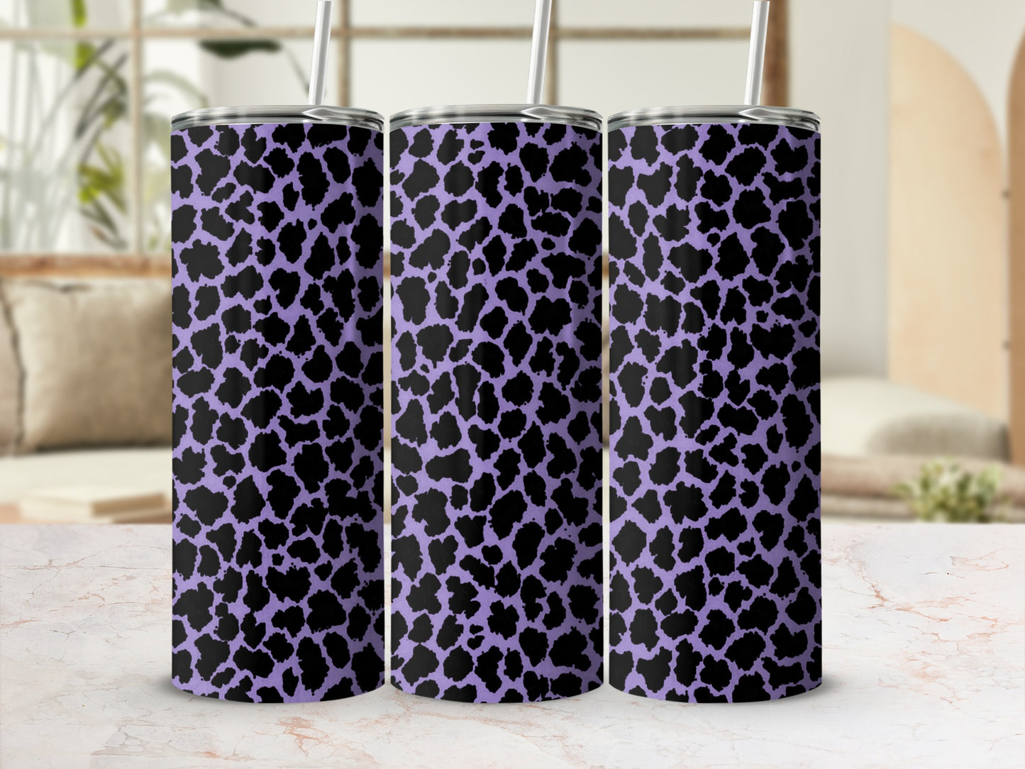 Three tumblers with a purple and black dalmatian spot pattern.