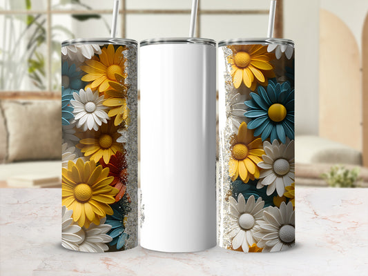 White tumbler with a floral design of daisies in yellow, blue, and white.