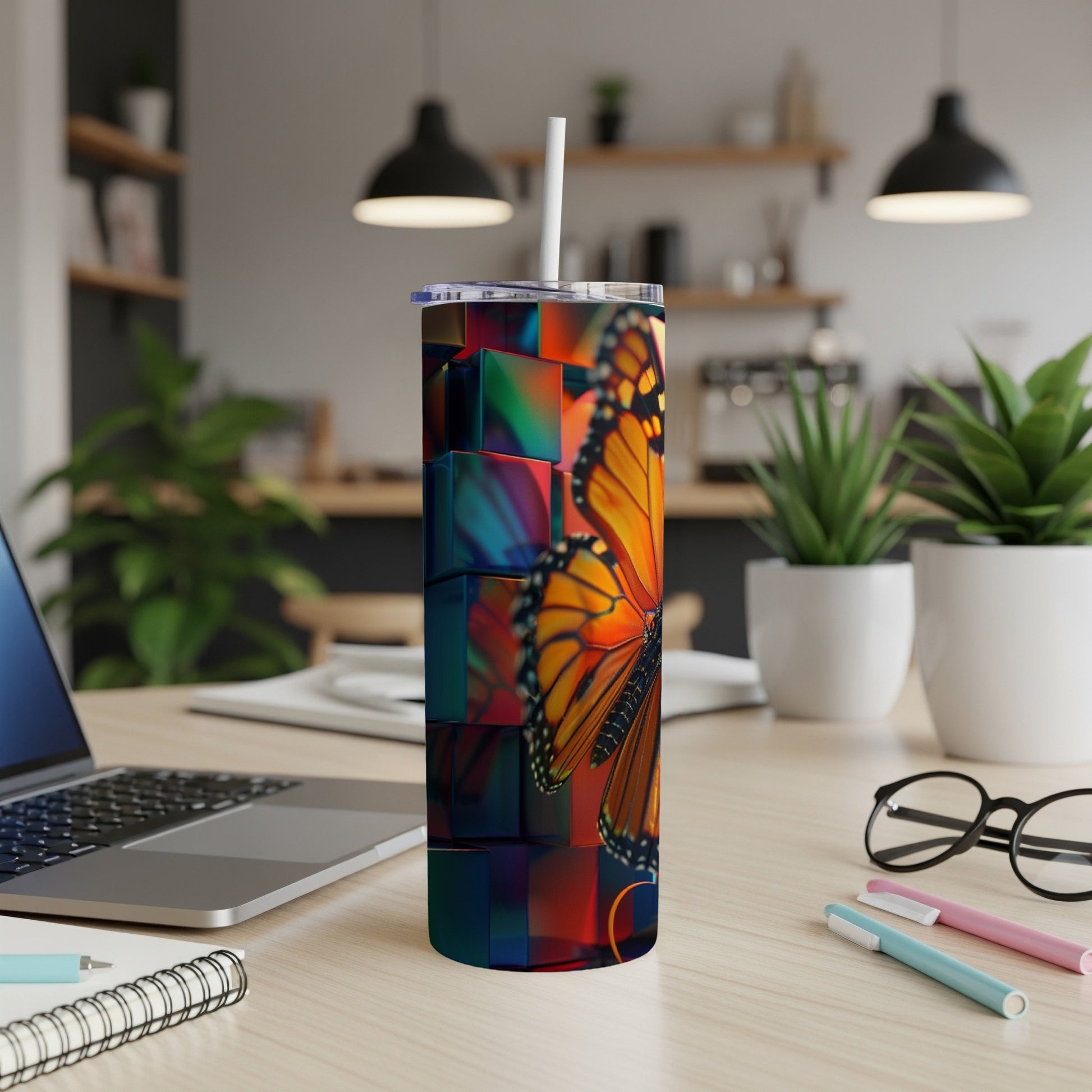 Tumbler with a vibrant butterfly on a background of colorful geometric shapes.