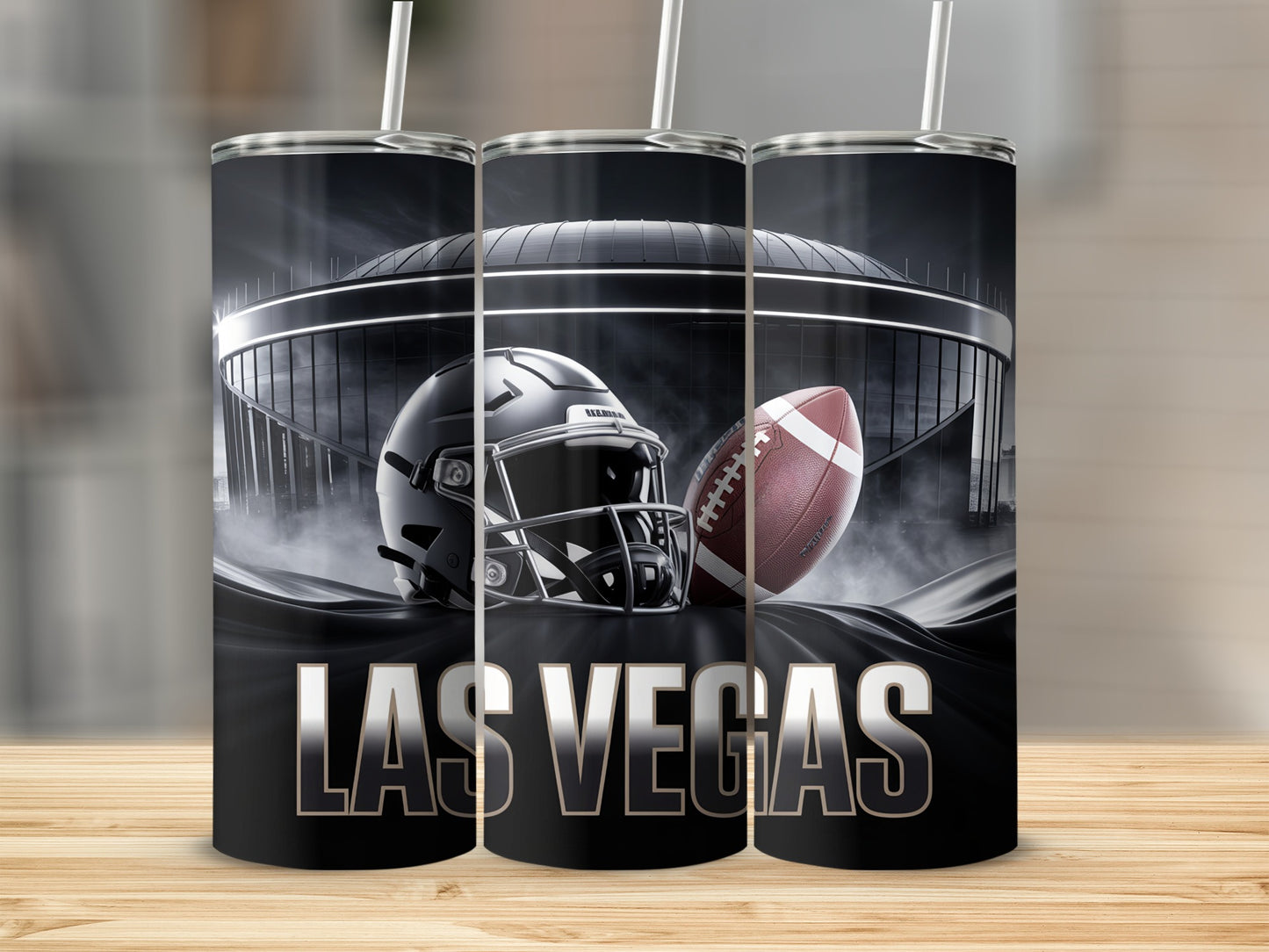 Las Vegas stadium, helmet, and football on a black tumbler.