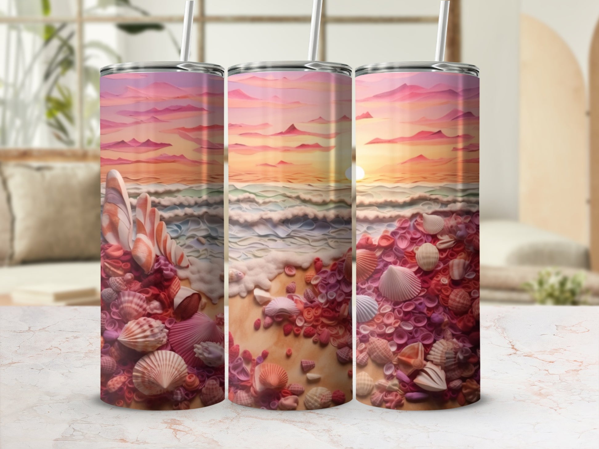 Beach scene with seashells and sunset depicted on three tumblers.