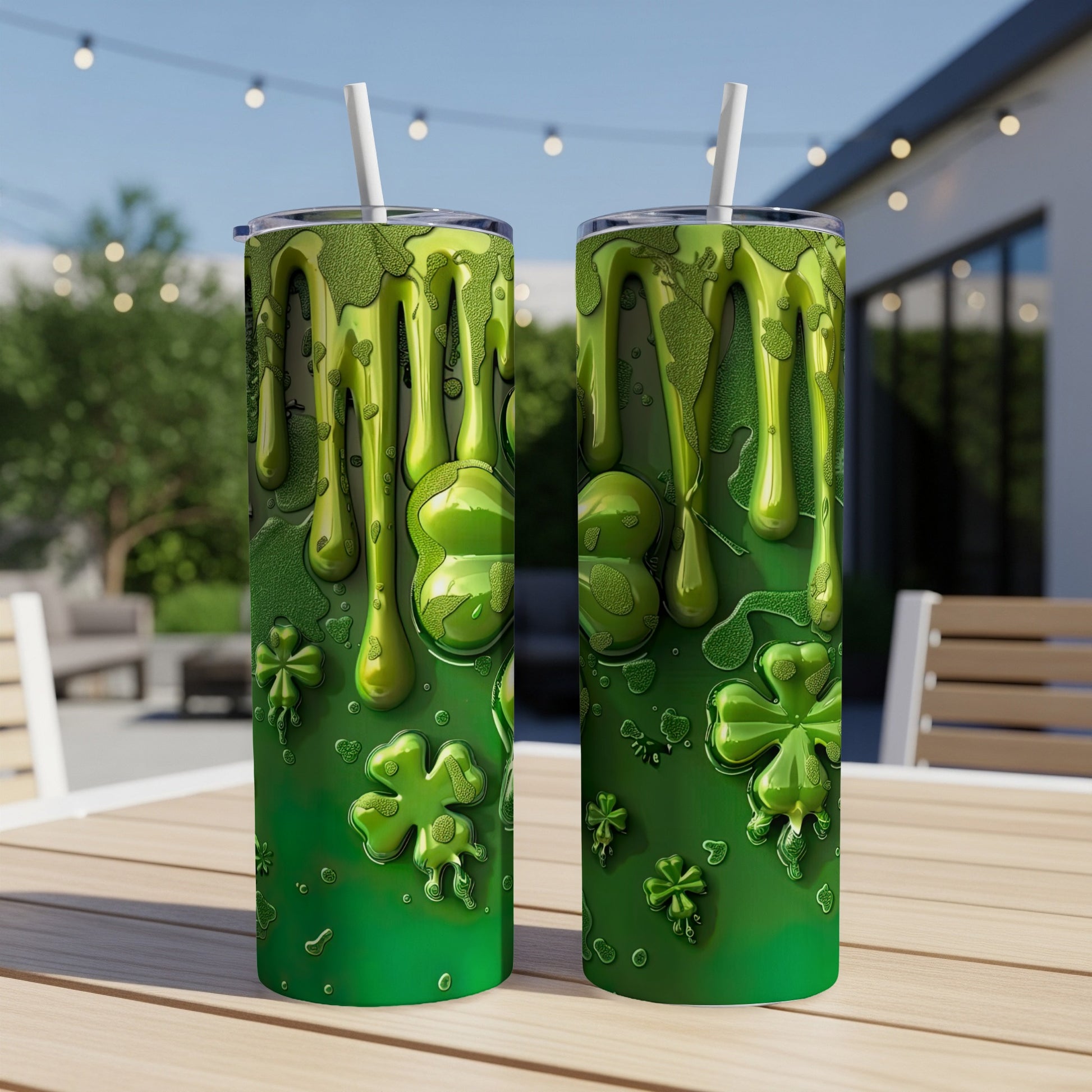 Green slime drips over shamrocks and dollar signs on two tumblers.