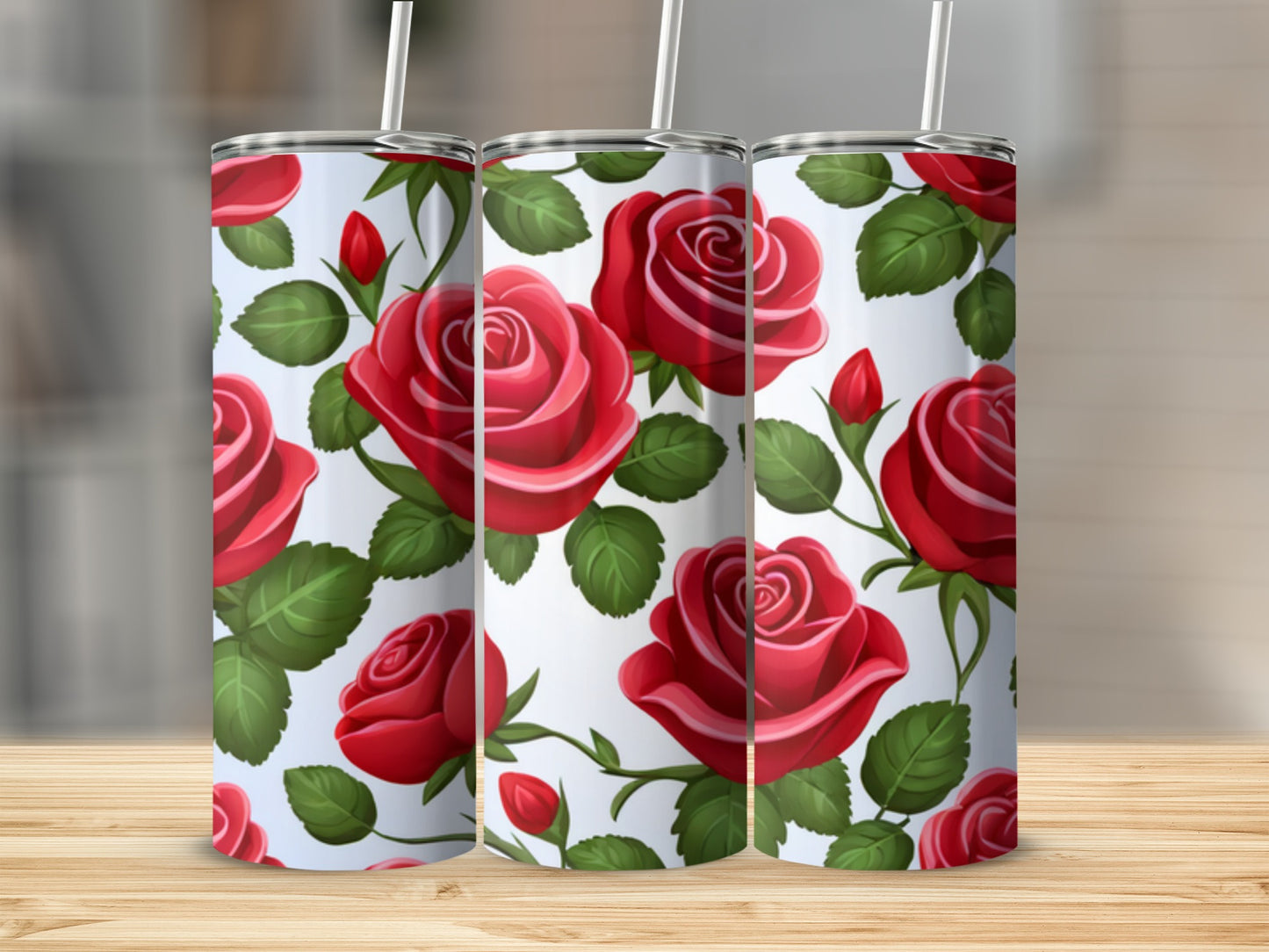 Three tumblers with a repeating pattern of red roses and green leaves.
