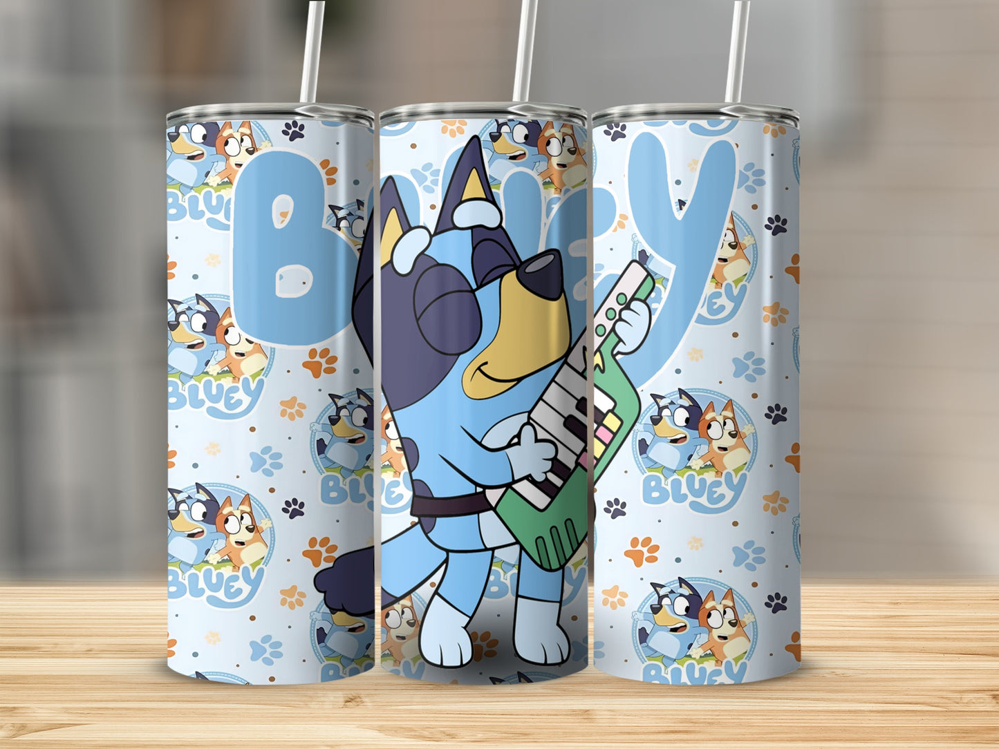 Bluey character with guitar on a patterned tumbler.