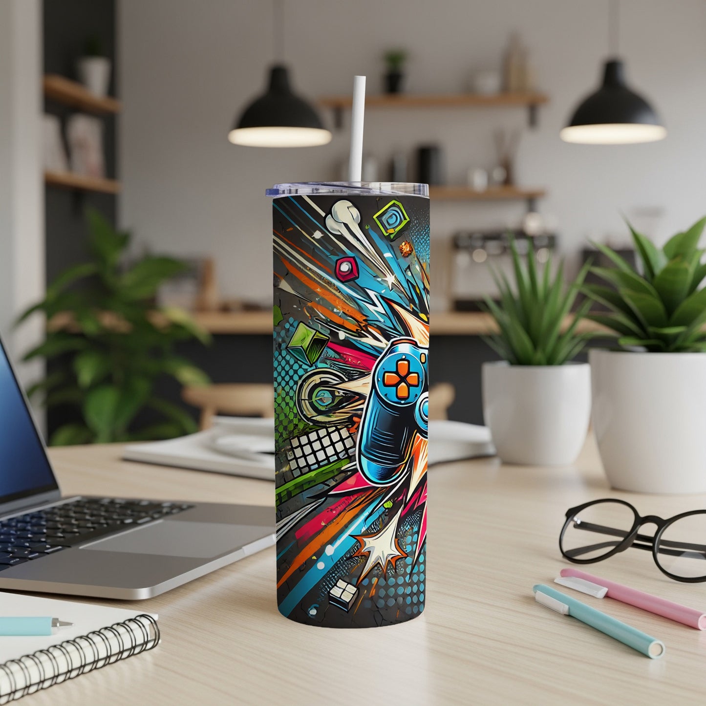 Abstract gamer controller design on a tumbler with a straw.