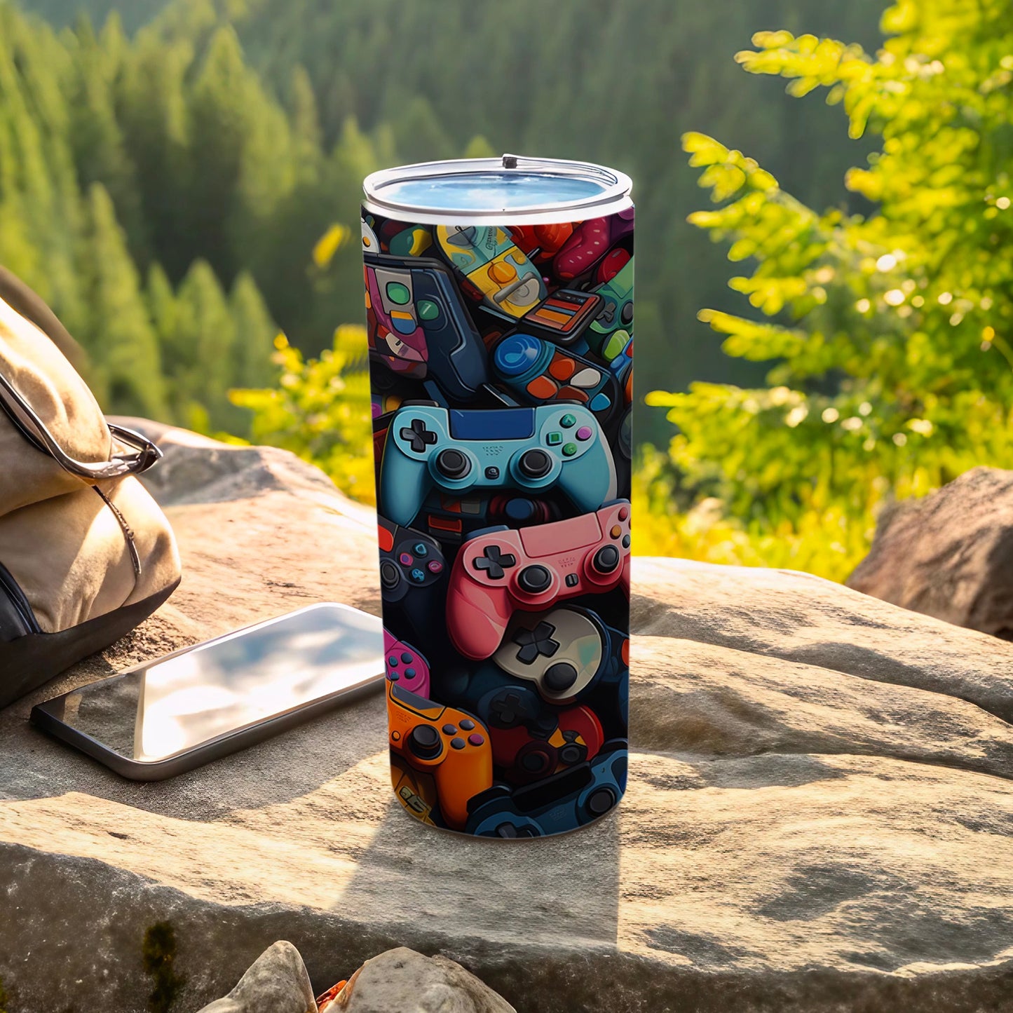 Gamer tumbler with collage of colorful video game controllers.