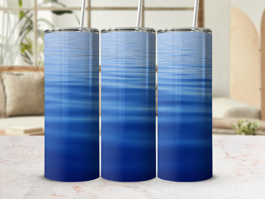 Three blue water ripple pattern tumblers on a marble surface.