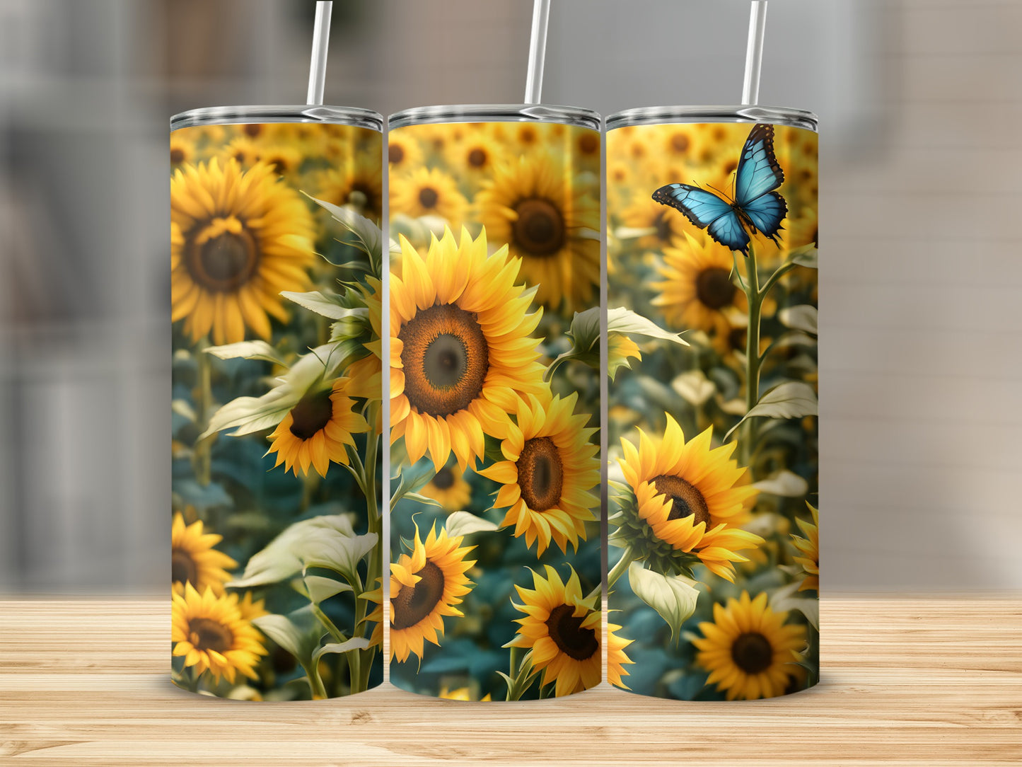 Three tumblers with sunflowers and a butterfly design.