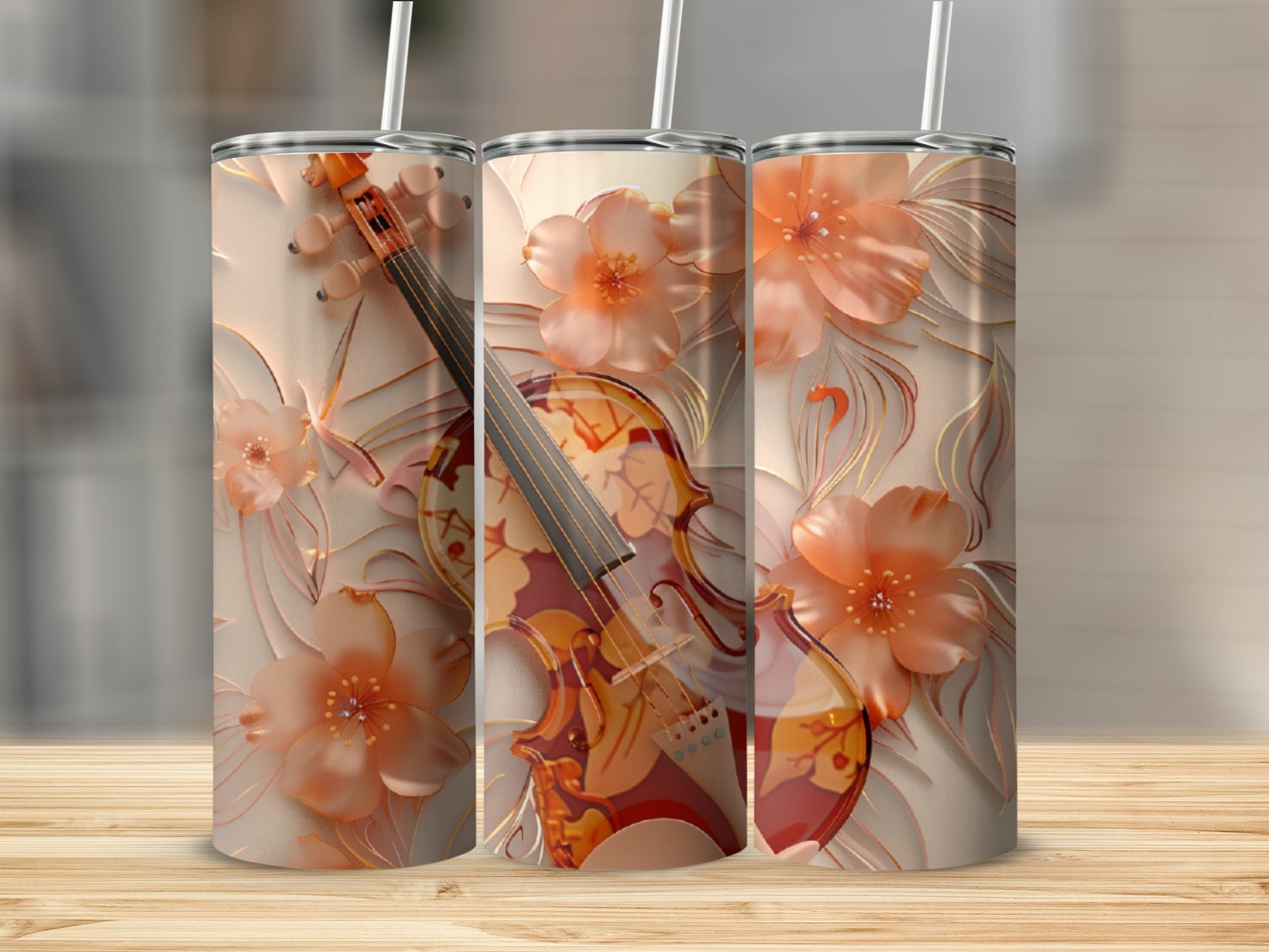 Three tumblers with a floral violin design on a wooden surface.