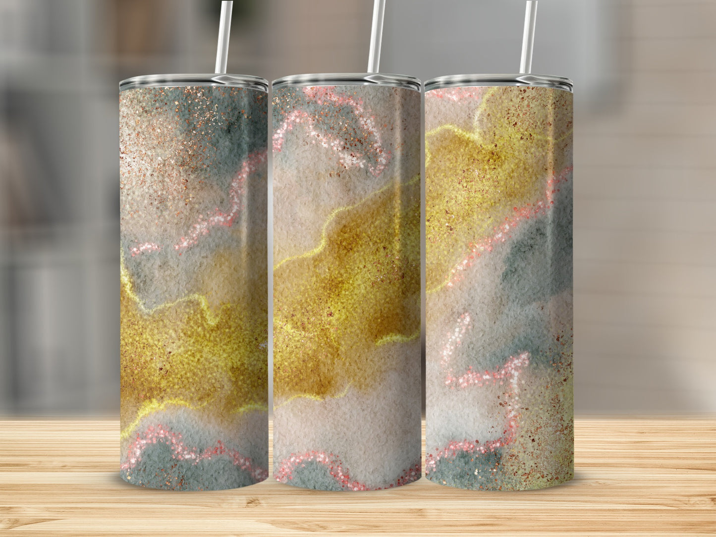 Three tumblers with abstract watercolor and glitter design.