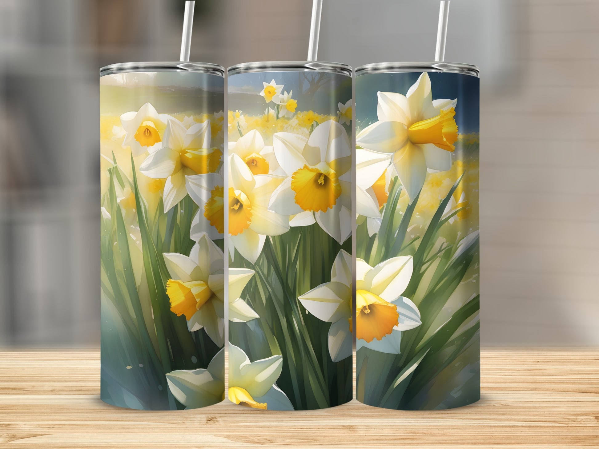 Three tumblers with blooming daffodils and green stems.