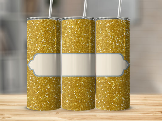 Three glitter tumblers with blank label placeholders on a wooden surface.