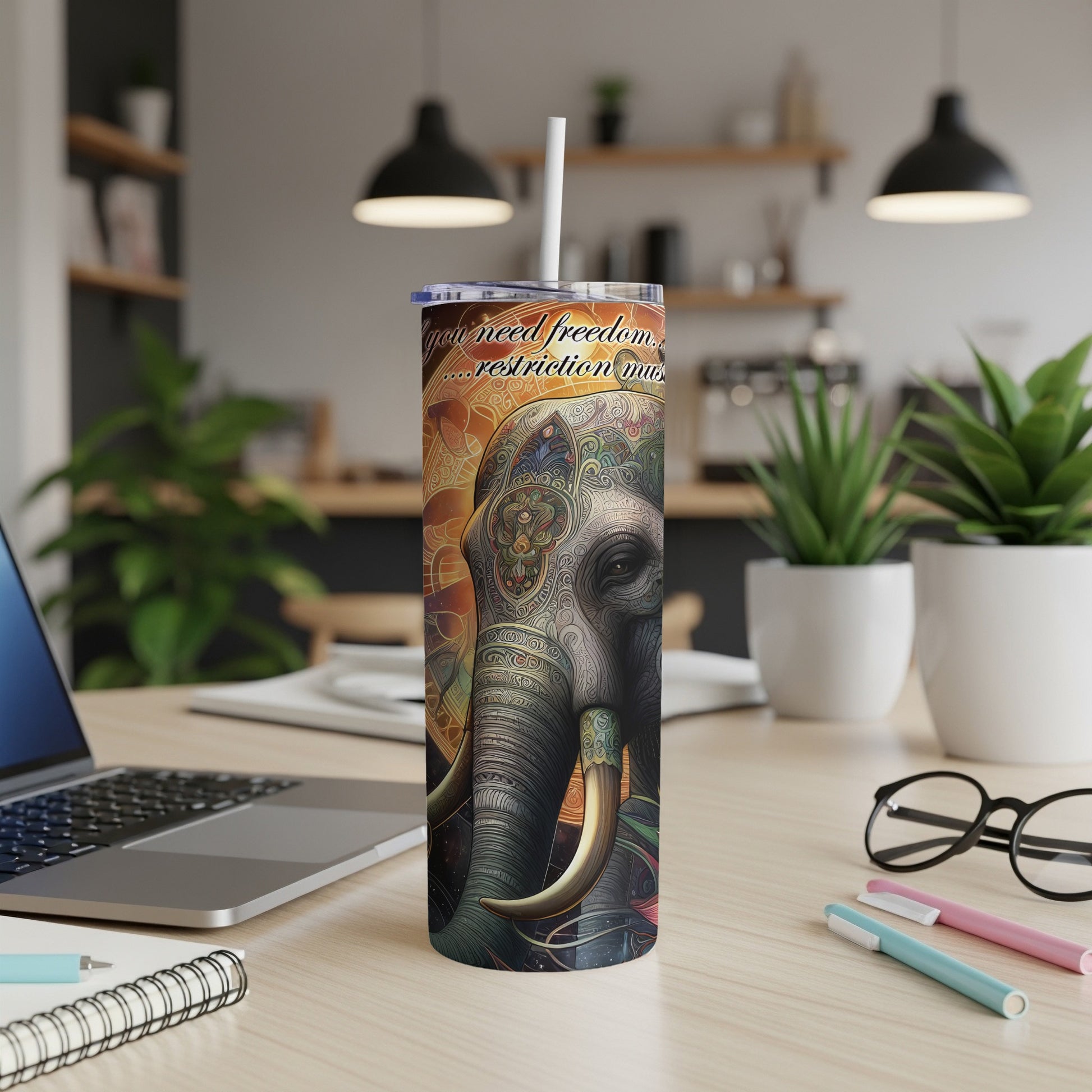 Elephant tumbler with intricate patterns and motivational text.