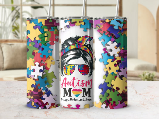 Autism Mom accepts, understands, loves puzzle tumbler with colorful puzzle pieces background.