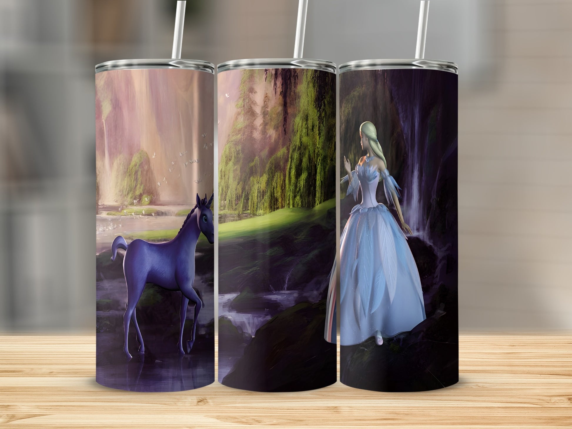 Three tumblers with fantasy forest, waterfall, and unicorn scenes.