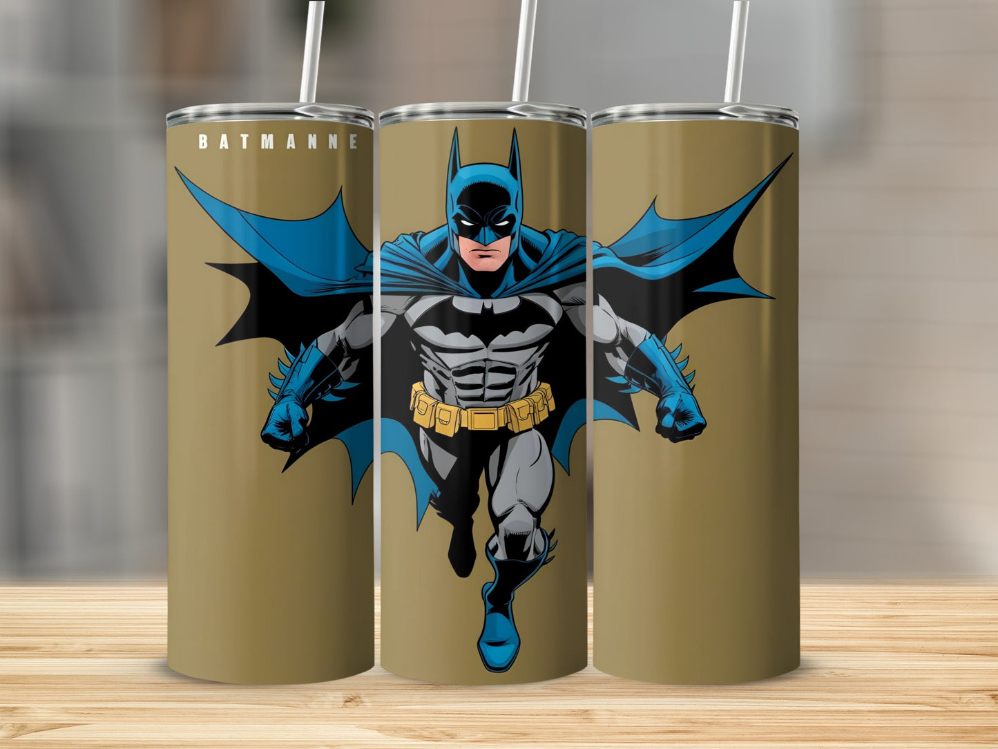 Batman comic art on a gold tumbler with straw.