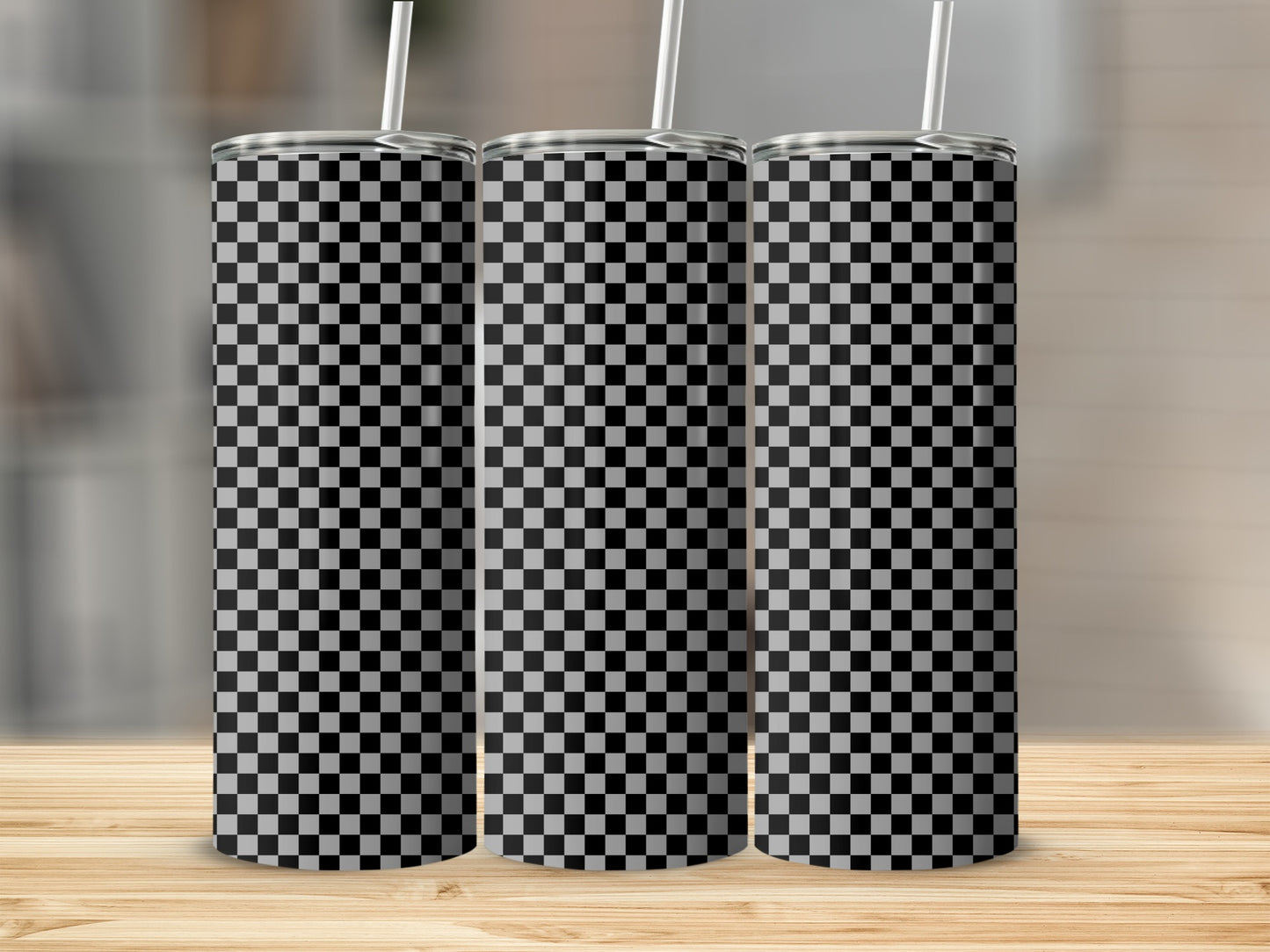 Three blank tumblers with a black and white checkered pattern.