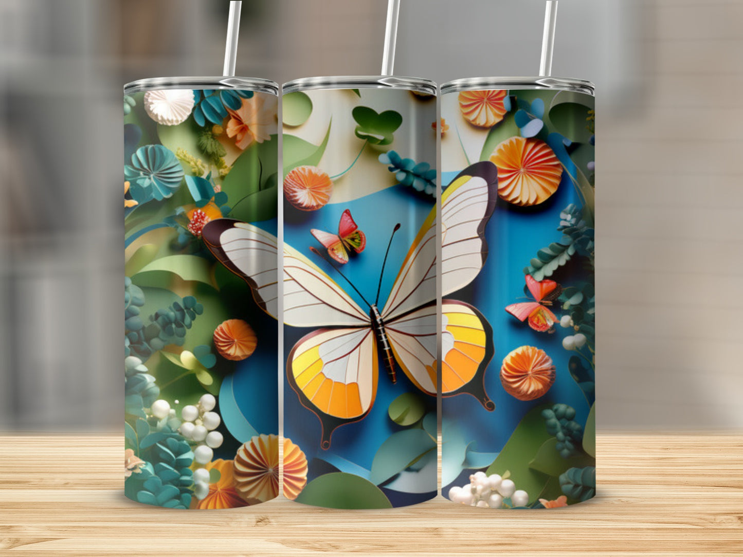 Three tumblers featuring a large butterfly and floral papercraft designs.