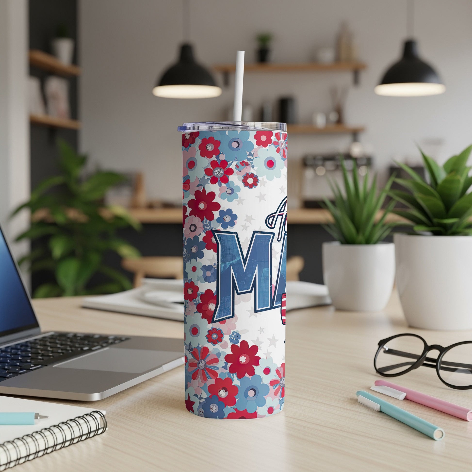 Floral tumbler with "Mama" text, a straw, and office desk background.