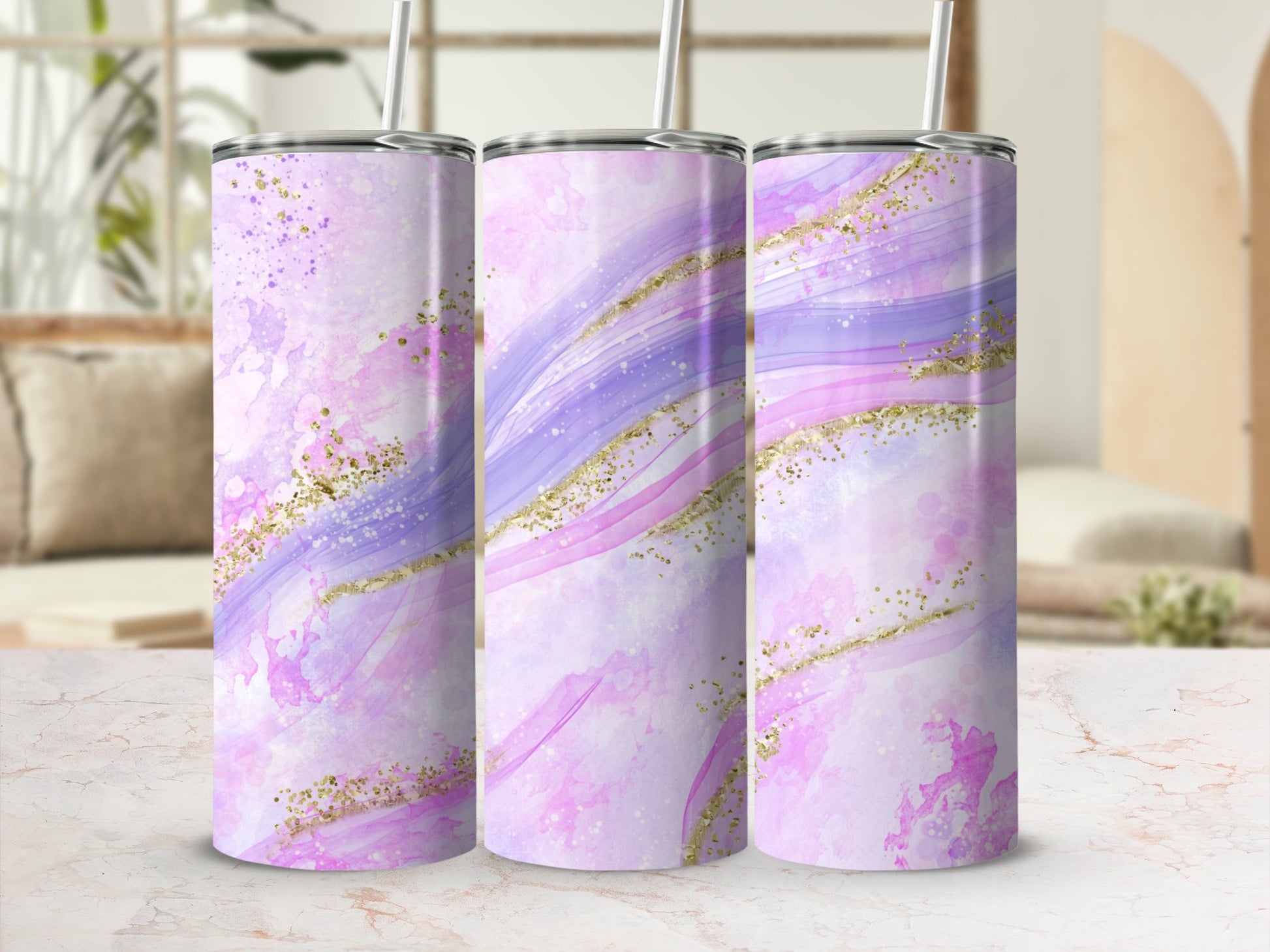 Three pink and purple abstract glitter tumblers with straws.