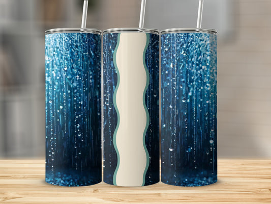 Three tumblers with a blue glittery background and cream wave design.